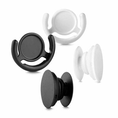 Suporte plástico para celular. Material plástico colorido, possui “disco” anelar retrátil que ao ...