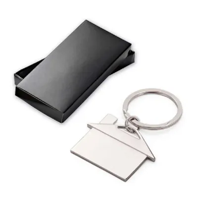 Chaveiro de metal em formato de casa com caixa